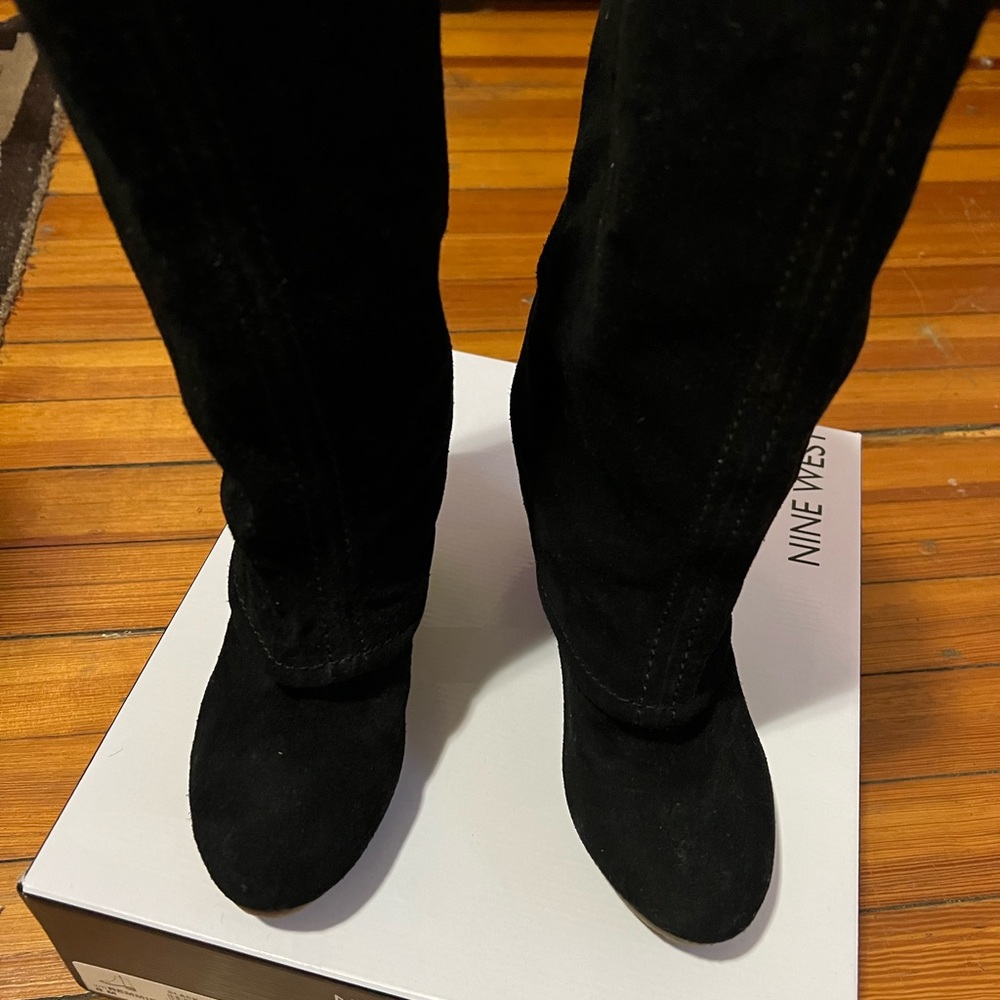 Gently worn MRKT Womens suede boots with rubber wedge heel.
